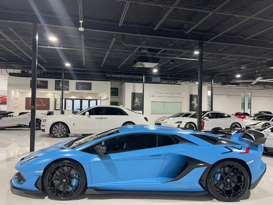 A baby blue Lamborghini huracan parked and on display at a Toronto